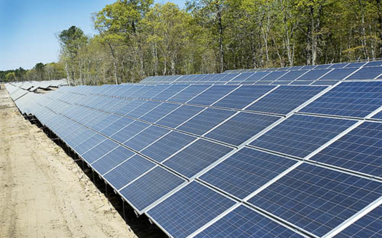 CATCHING SOME RAYS: A solar farm under construction last year in the southeast corner of the Brookhaven National Laboratory site on Long Island, a project of BP Solar, the U.S. Department of Energy, and the Long Island Power Authority.