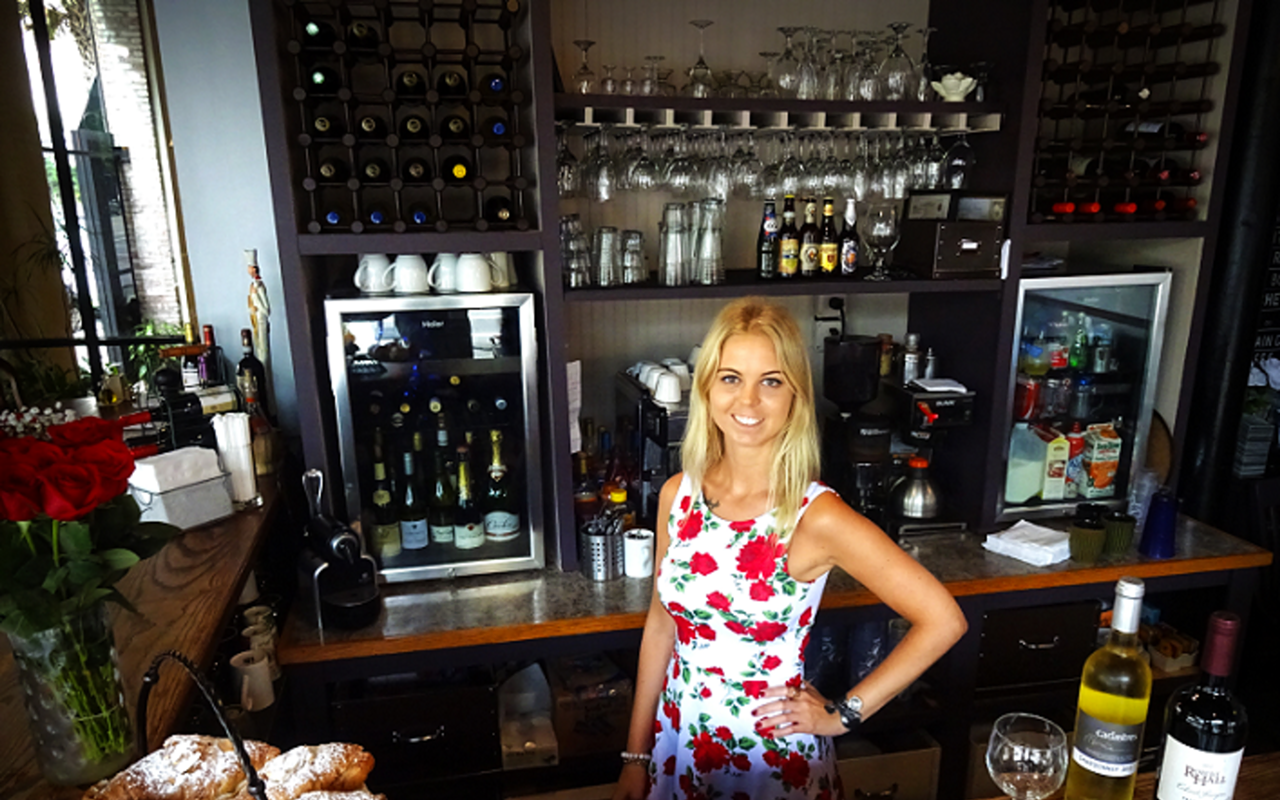 L'Eden's Priscilla Vincent behind the bar of her updated French oasis.