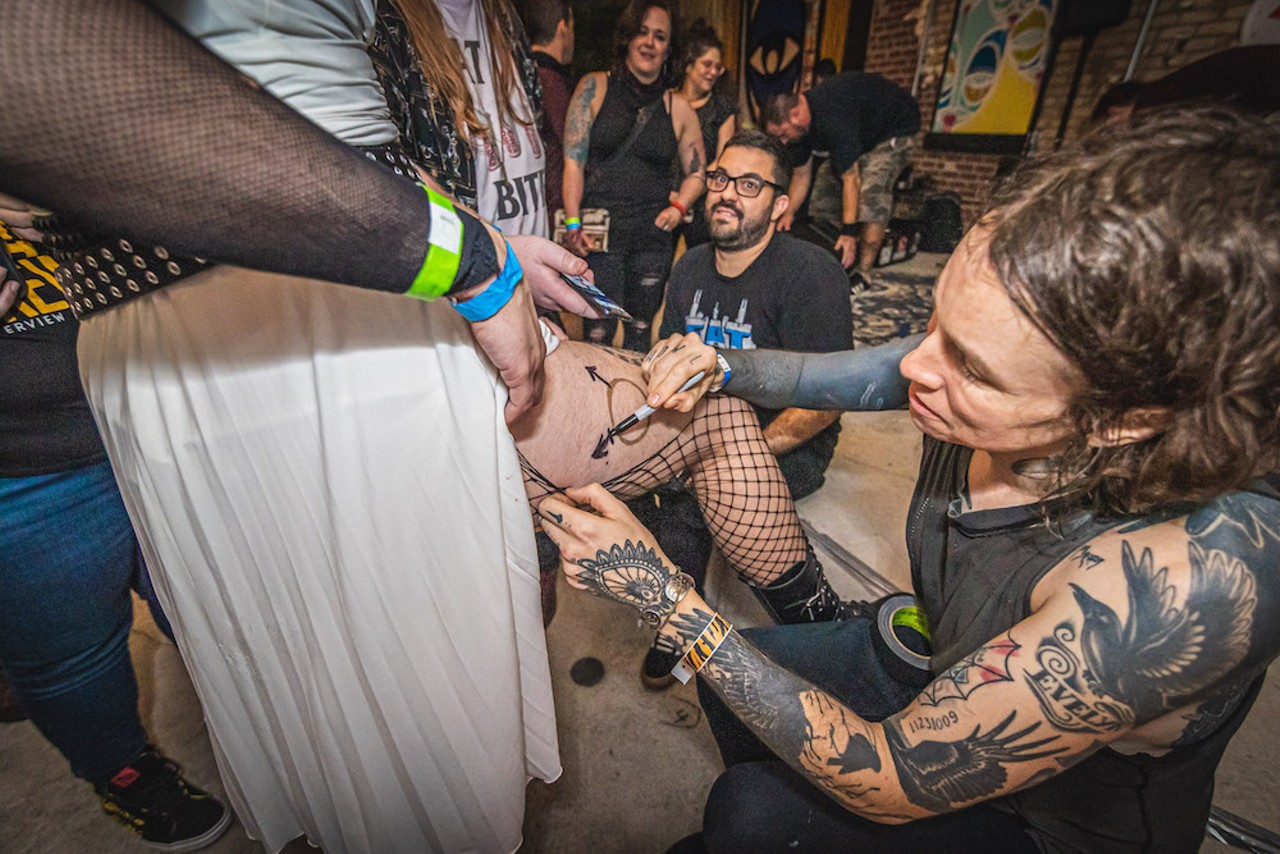 Laura Jane Grace readies a tattoo for a fan after her Dec. 10, 2021 concert at The Bricks in Ybor City, Florida.